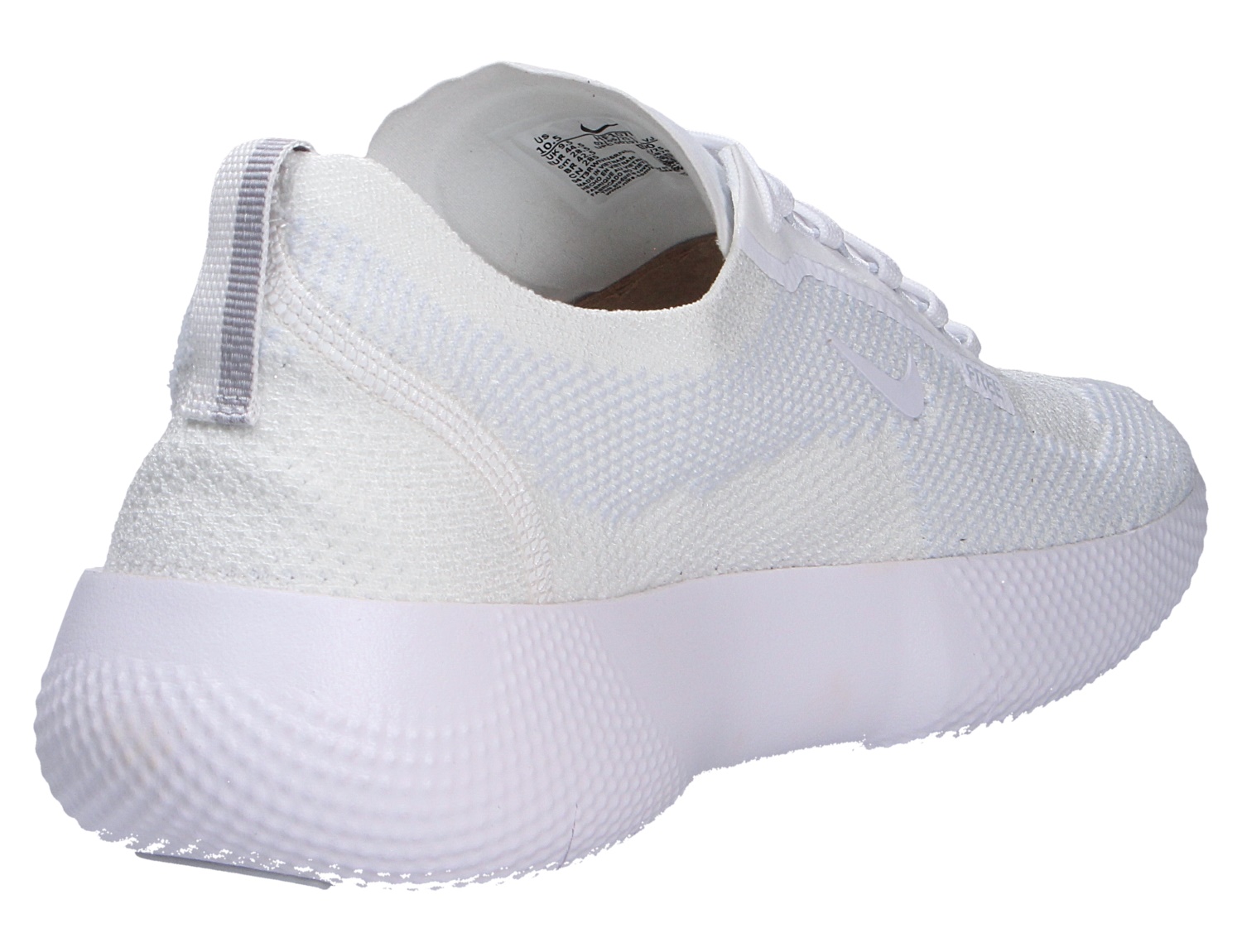 Nike FREE 2025 weißer Sneaker mit strukturierter Sohle und atmungsaktivem Obermaterial in Rück- und Seitenansicht